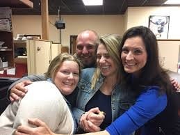 people hugging in a group